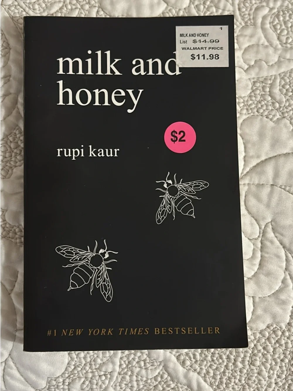 Collection of Decorative Paperback Books in Black, Cream, and Blue